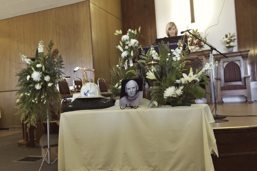 photo of funeral table at front of united church for bill snider celebration of life service in Oxbow Saskatchewan
