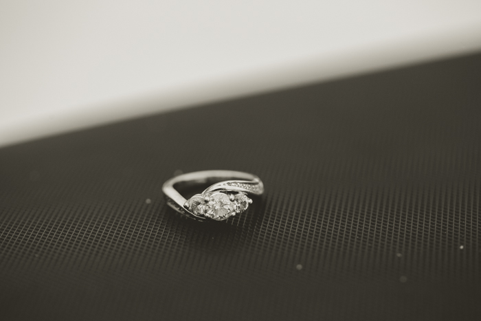 edgy photo of diamond engagement ring on a skidoo snowmobile