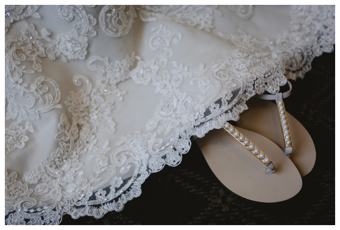 photo of lace wedding dress with sandals detailed with pearls