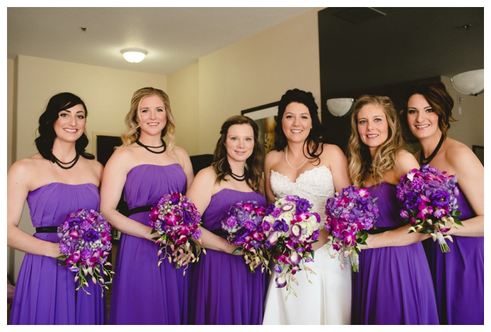 photo of brides and bridesmaids in beautiful purple strapless dresses with bouquets