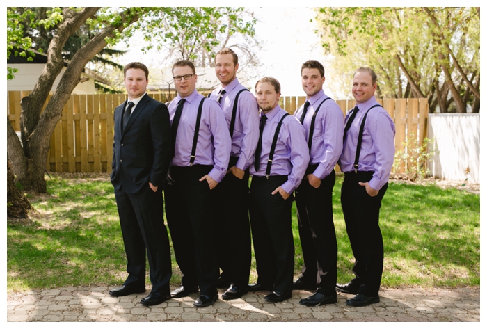 photo of groom and groomsmen in purple shirts and suspenders