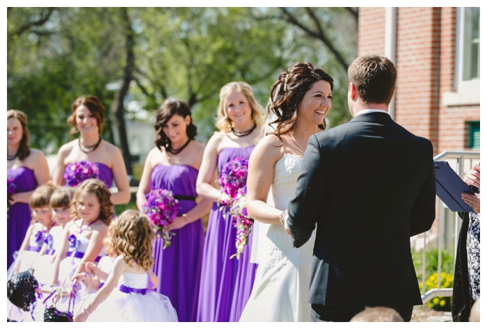 photo of bride and groom during sunny ceremony at the weyburn court house