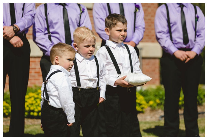 photo of handsome ring bearers during ceremony 
