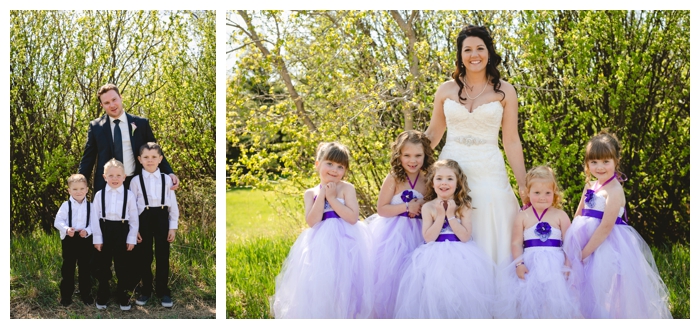 photo of beautiful bride with flower girls and groom with handsome ring bearers with suspenders