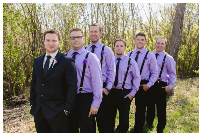 photo of groom and groomsmen wearing purple with suspenders