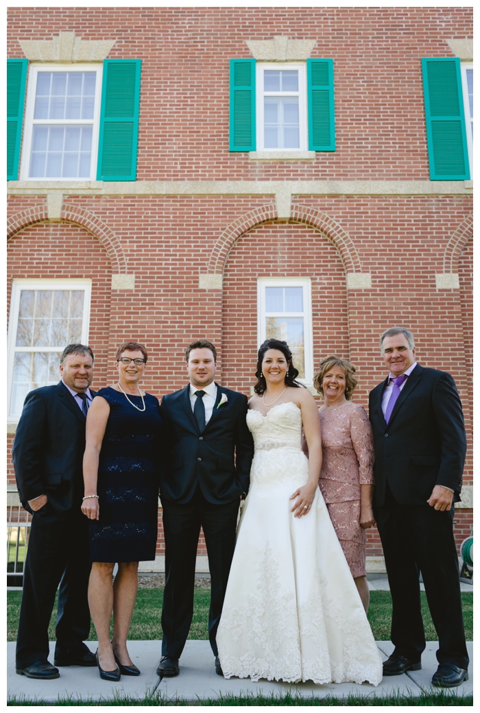 photo of happy couple with parents at spring wedding