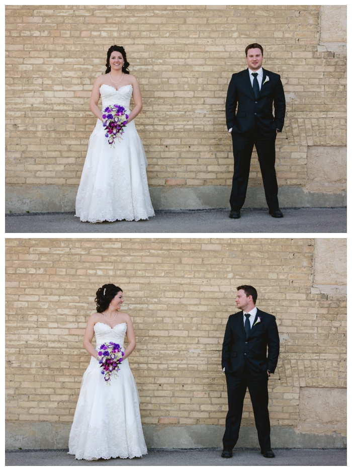 photo of bride and groom against brick wall