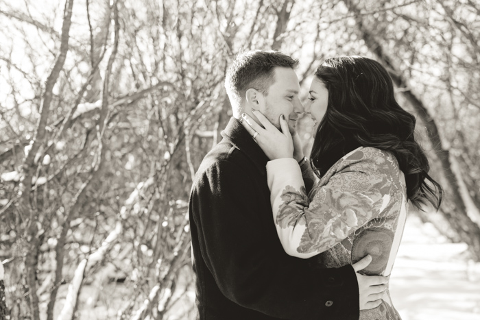 black and white photo of romantic couple in a woodsy winter shoot