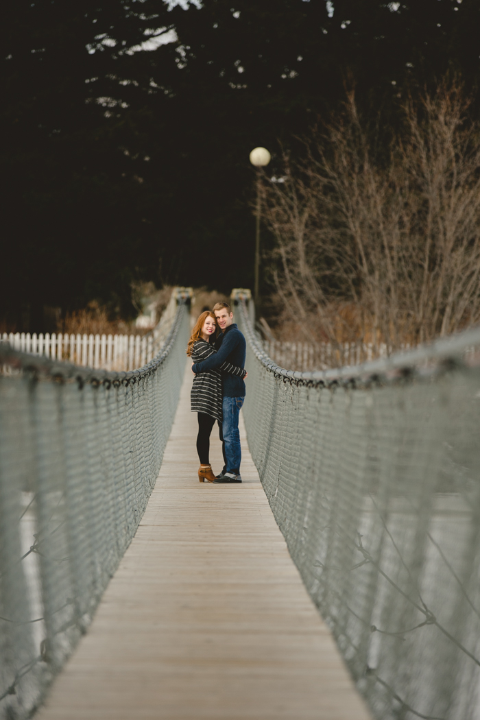 photo of engaged couple on bridge