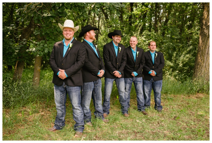 photo of groom with groomsmen with black cowboy hats and turquoise shirts