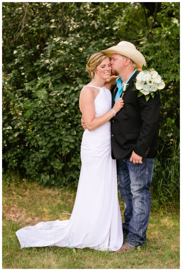 photo of newlywed bride and groom at country wedding