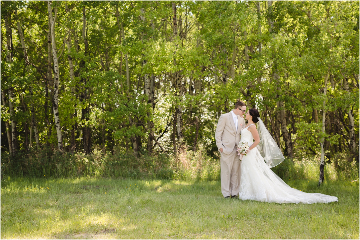 spring wedding couples portraits with veil in the wind