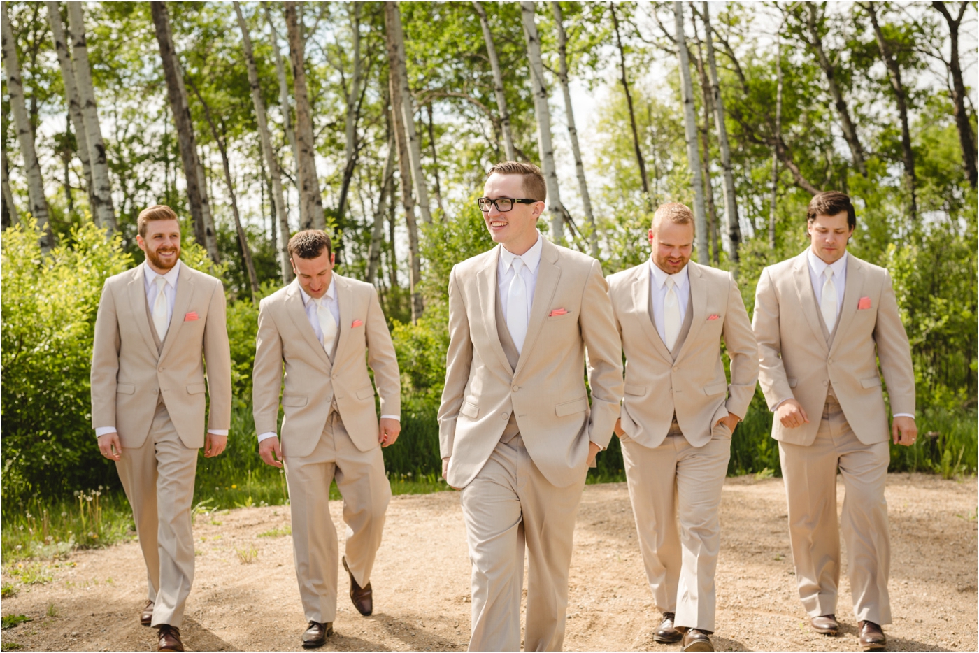 groomsmen in tan suits walking like reservoir dogs
