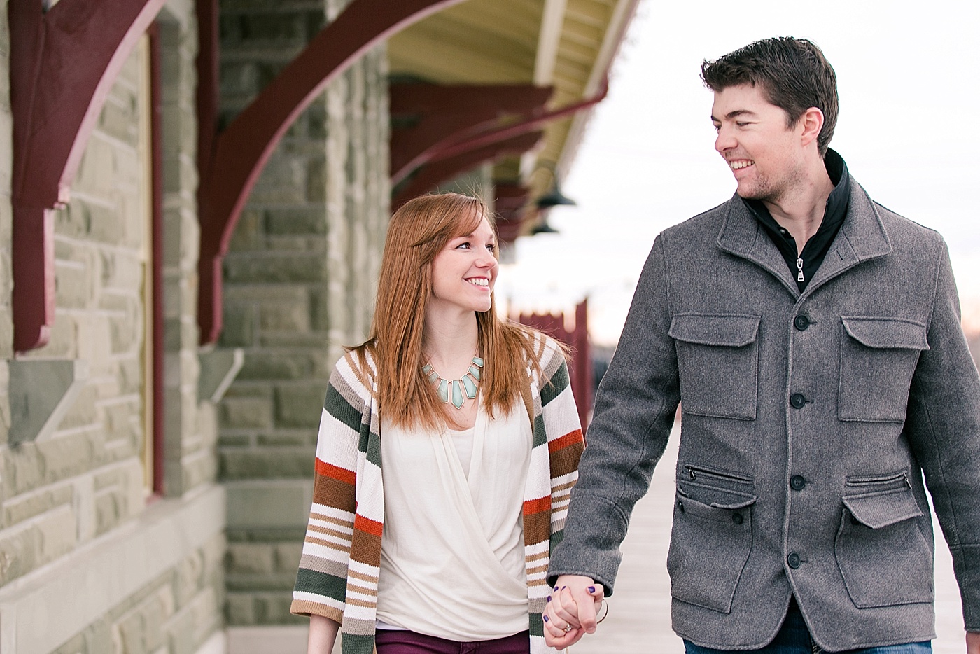 engaged couple walking hand in hand during calgary photo session
