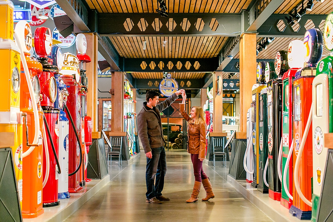 photo of engaged couple dancing in gasoline alley museum at heritage park