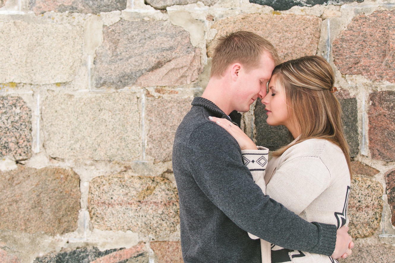 romantic winter engagement photos in front of old stone country school photos