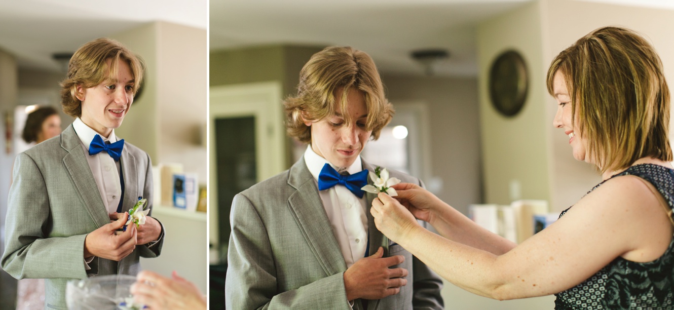 Mom pinning on boutonniere on grad day photo 