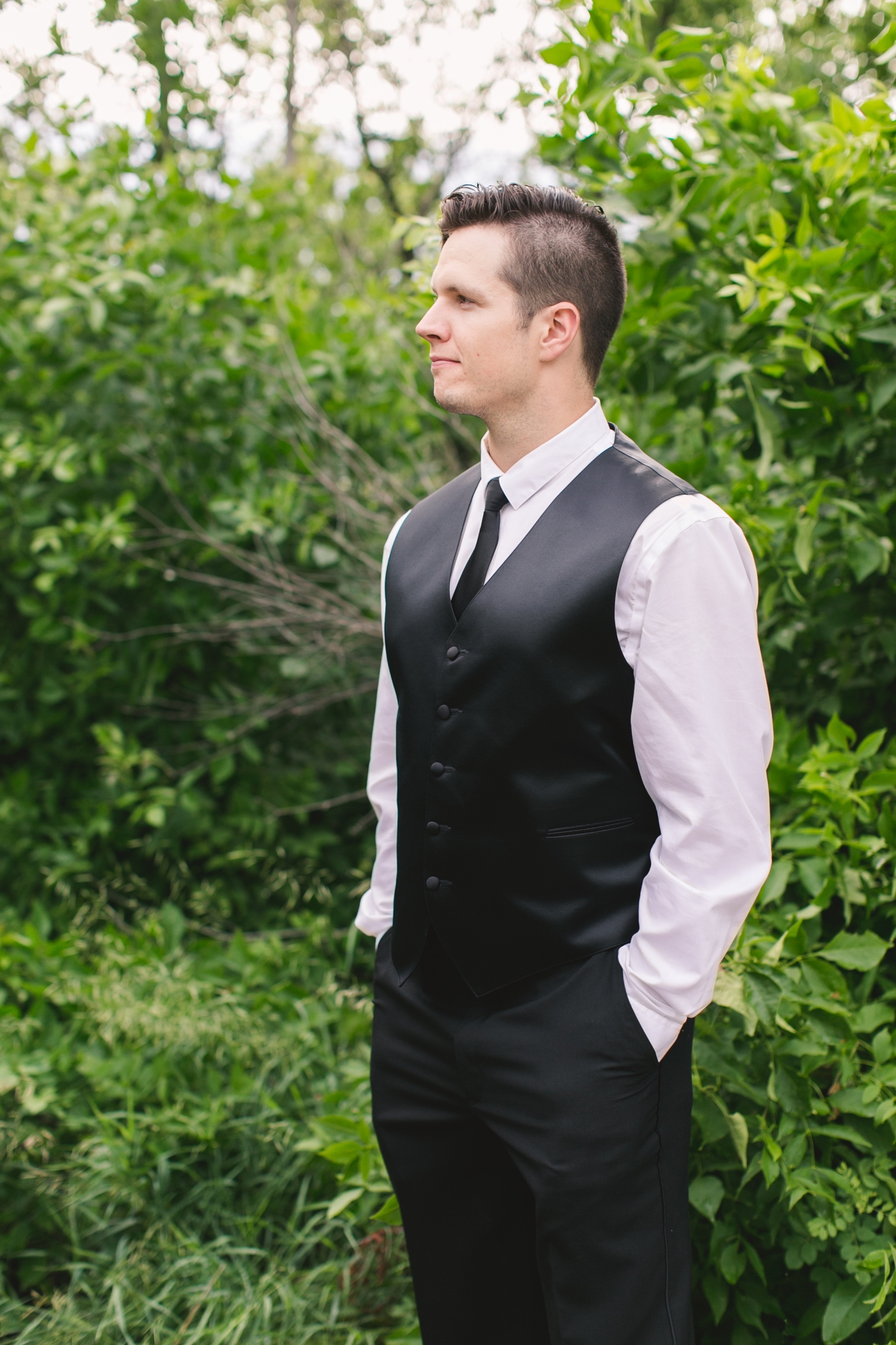 groom wearing black and white photo