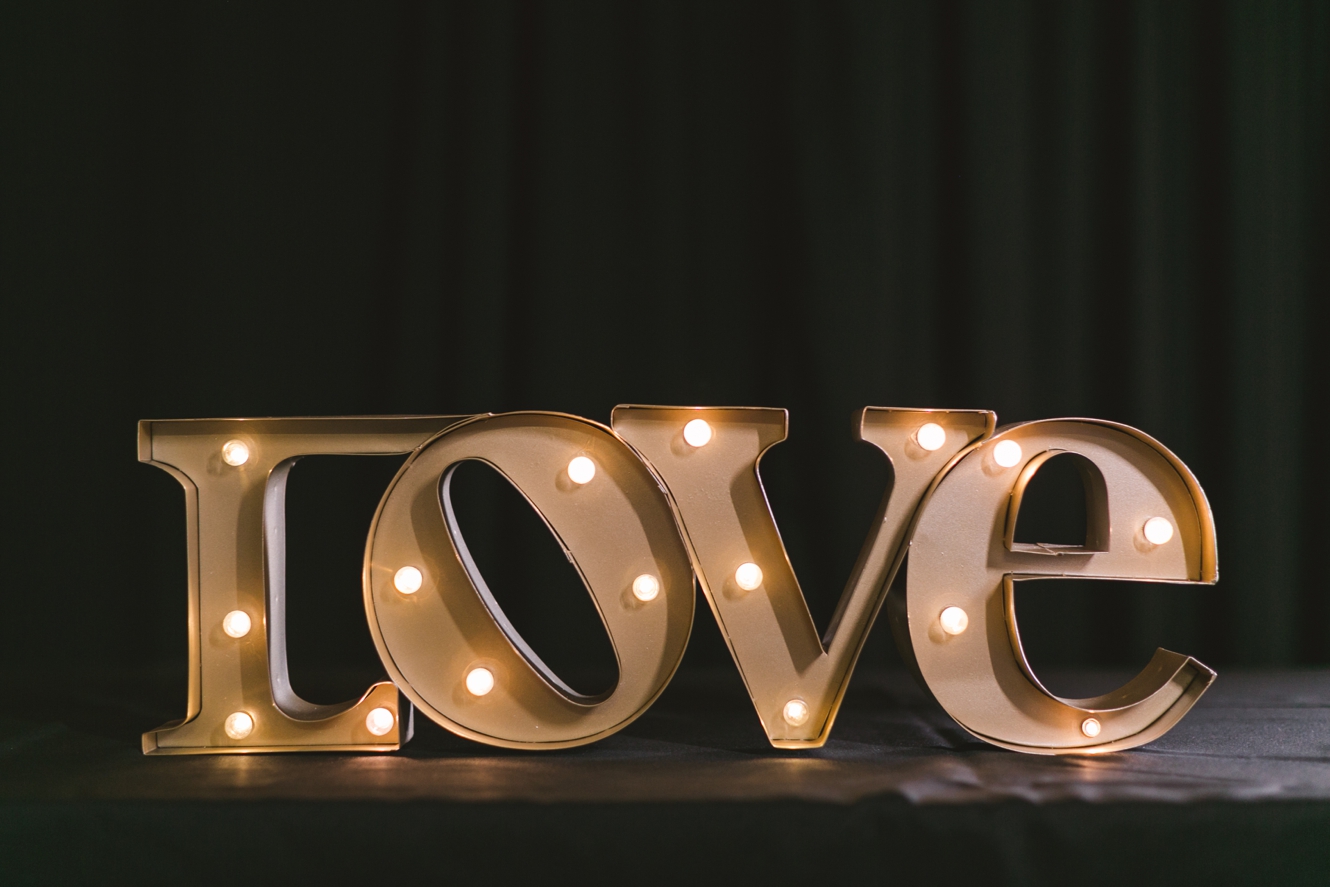 marquee light love sign at wedding photo