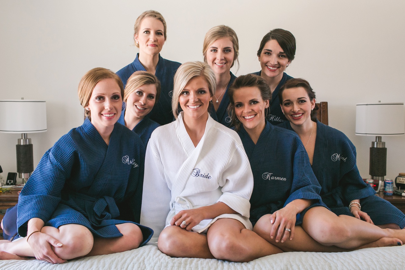 Bridesmaids dressed in robes before wedding ceremony pictures