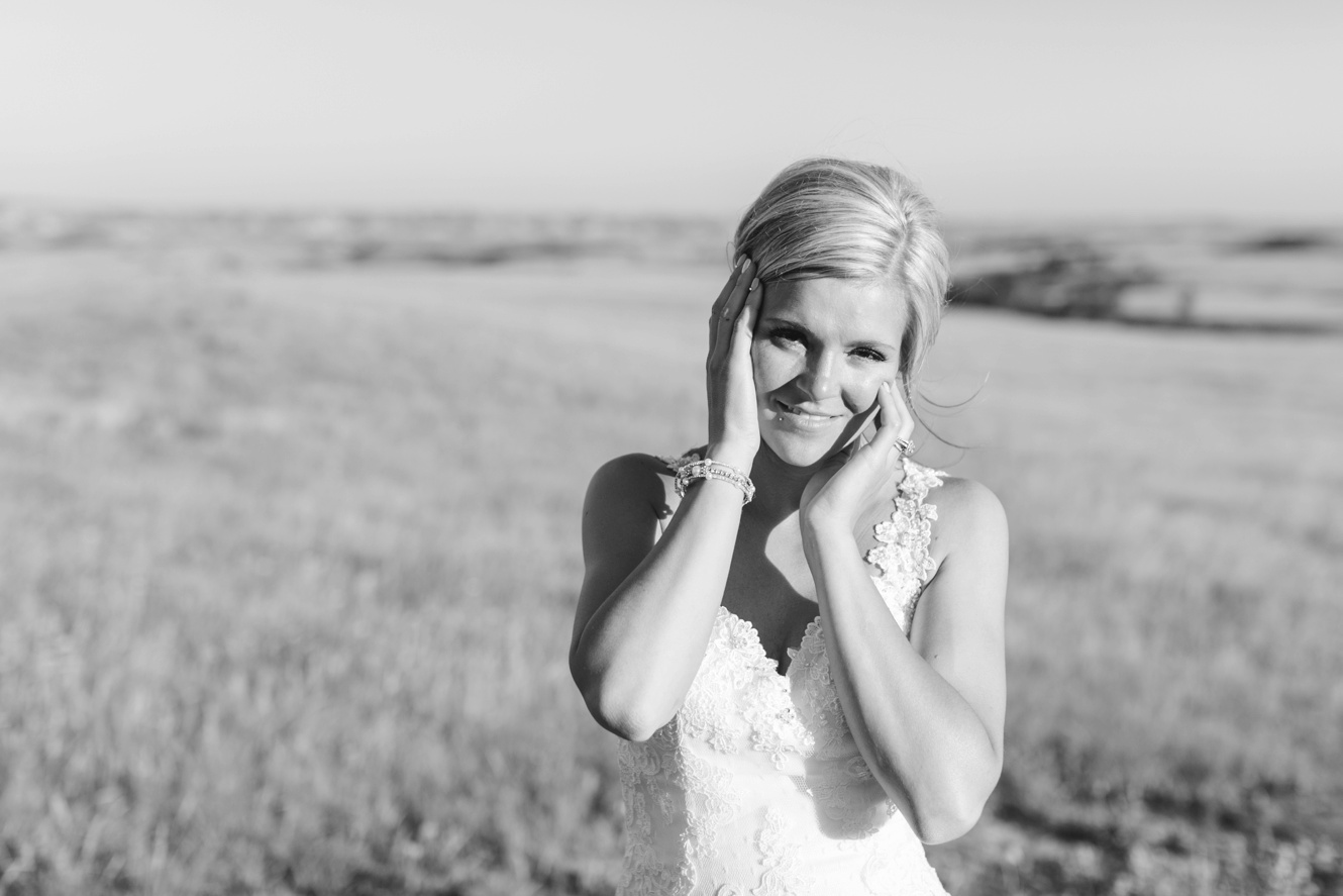 black and white photo of bride in a field