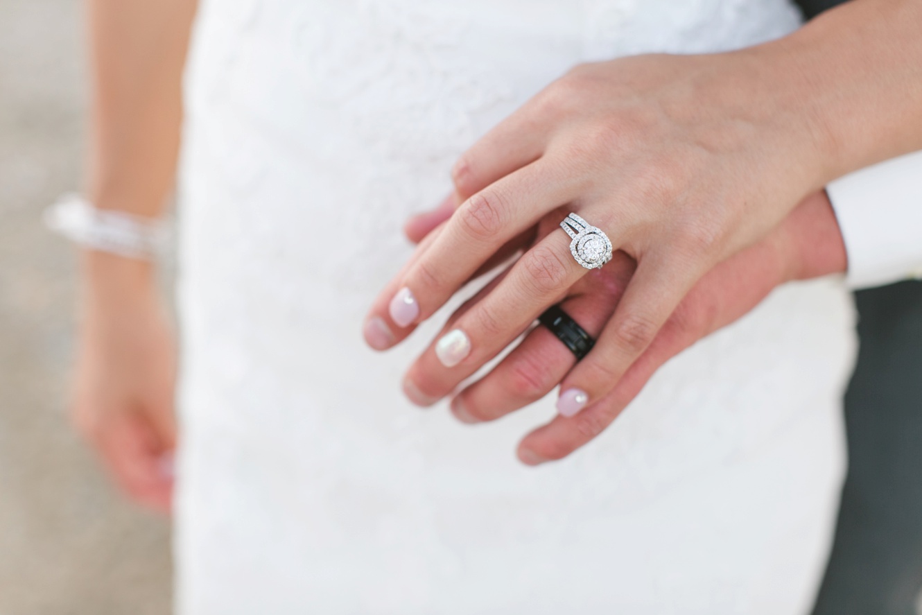 mens black wedding band and diamond engagement ring photo