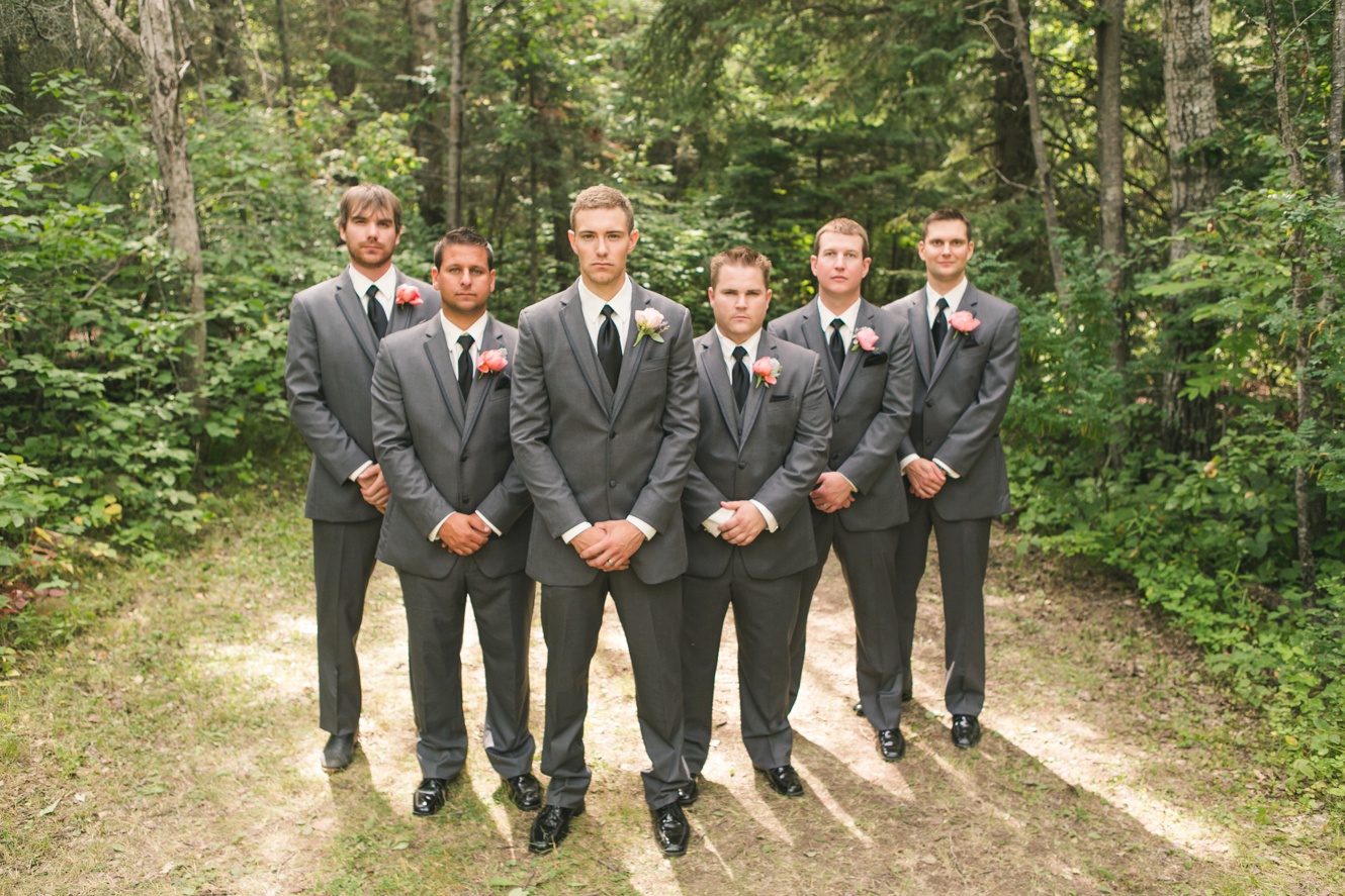 groomsmen in grey suits and blush boutonnieres photo 