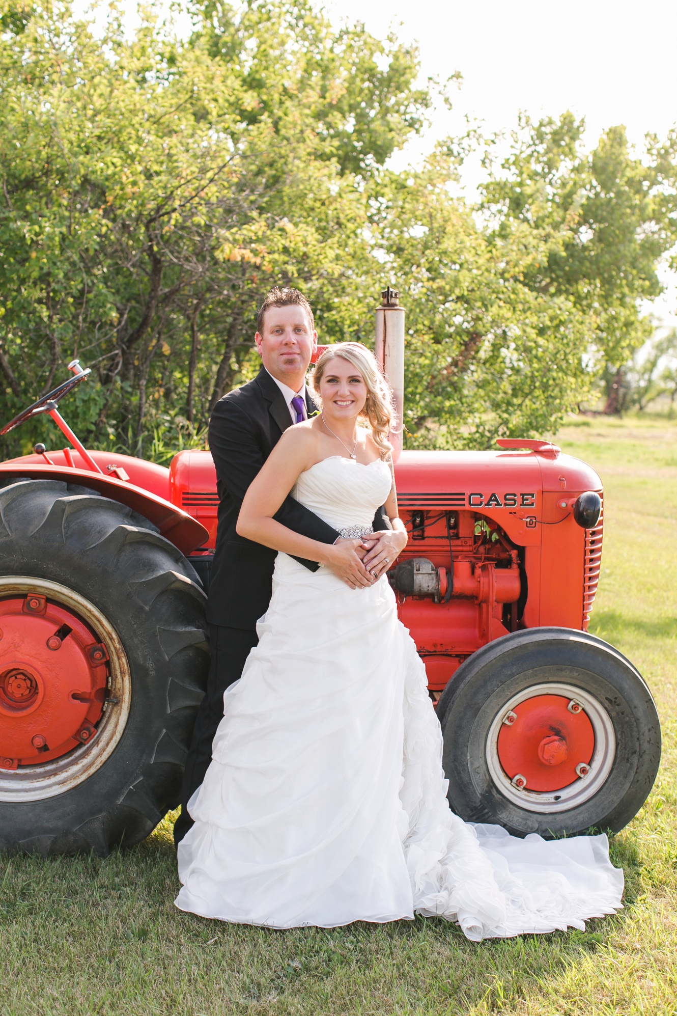 wedding photo with farm tractor photo