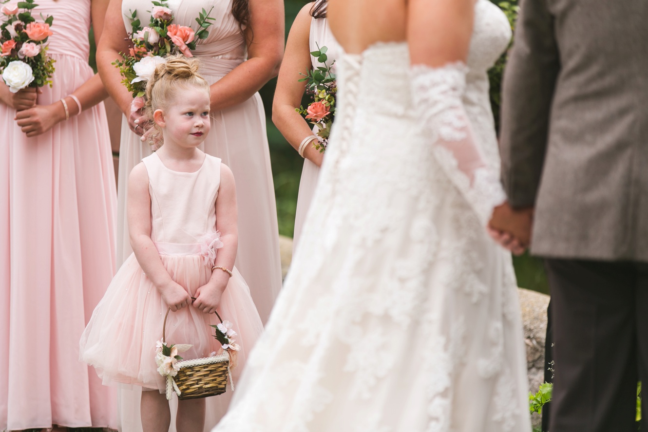 Adorable flower girl dressed in blush photo