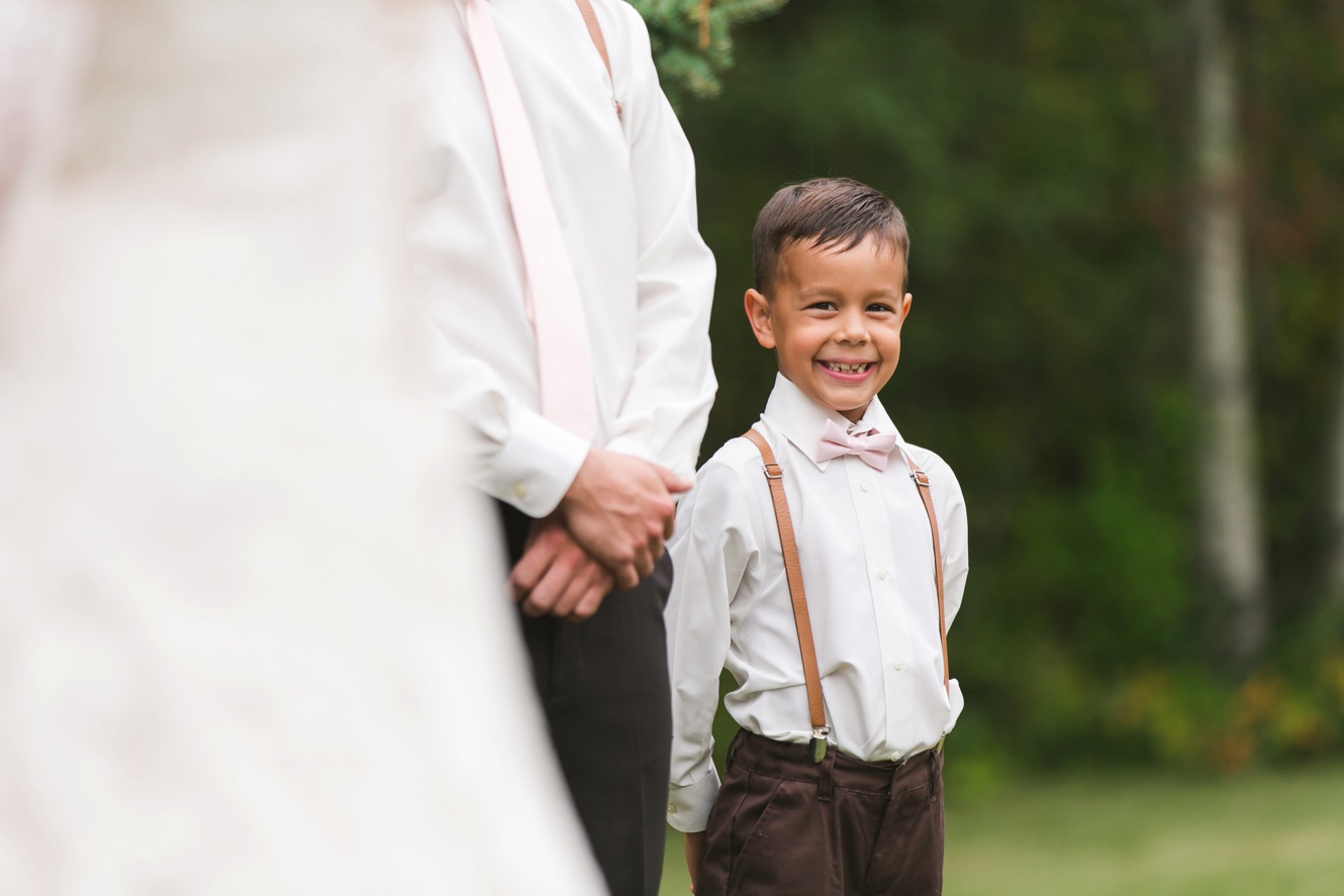 Adorable ring bearer photo with leather suspenders and blush bowtie photo
