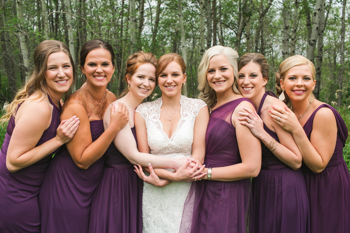plum bridesmaid dresses and lace bride gown fall wedding photo