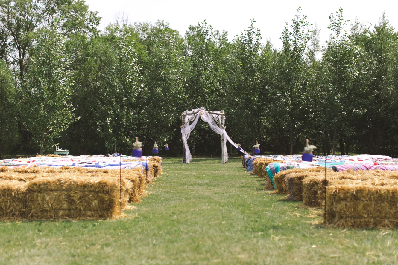 square bales and quilts wedding ceremony photo