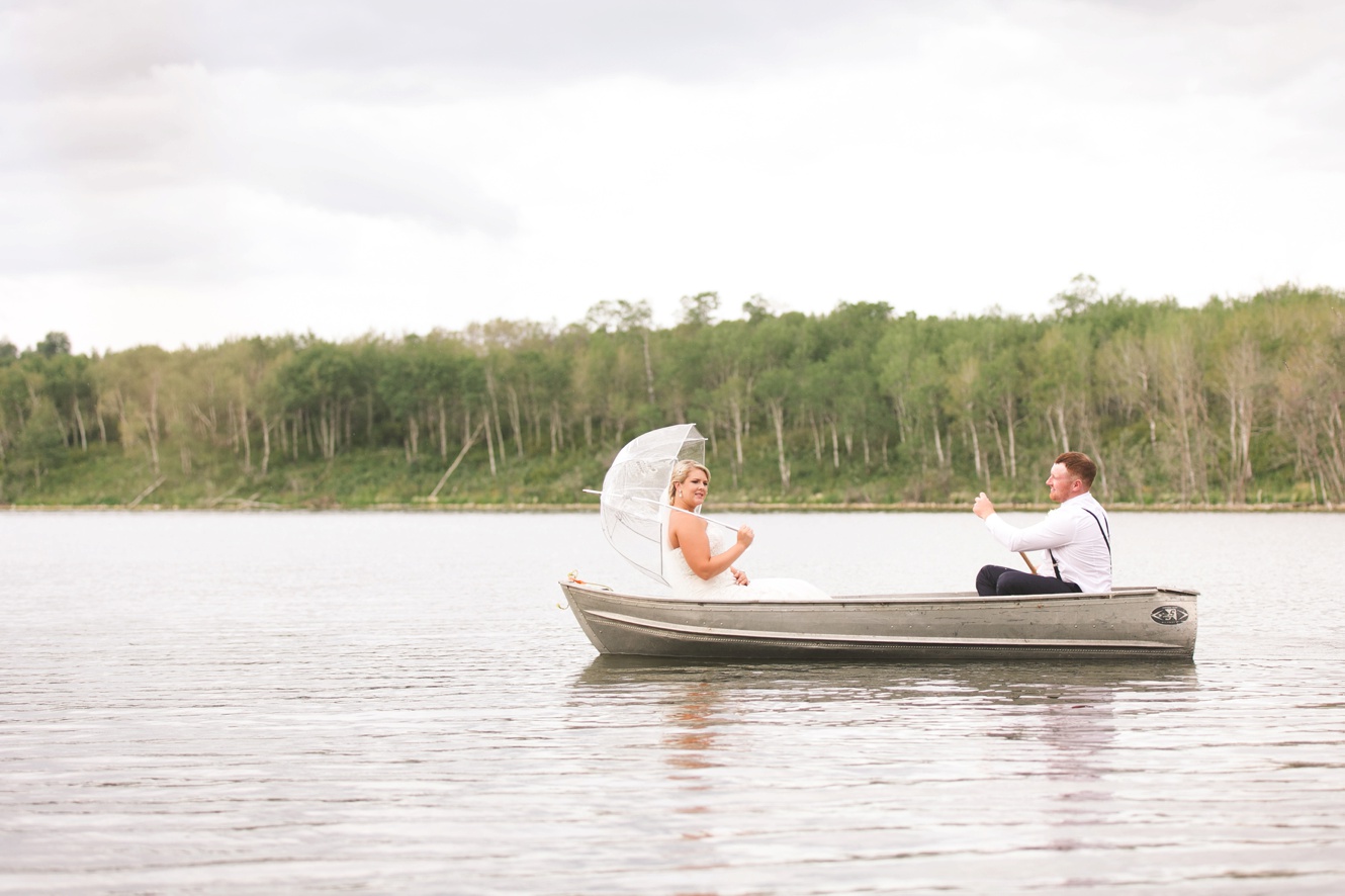The notebook inspired summer wedding photo in rowboat
