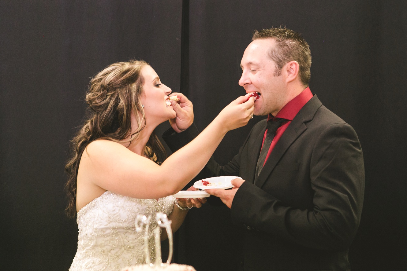 Bride and groom cake cutting photo