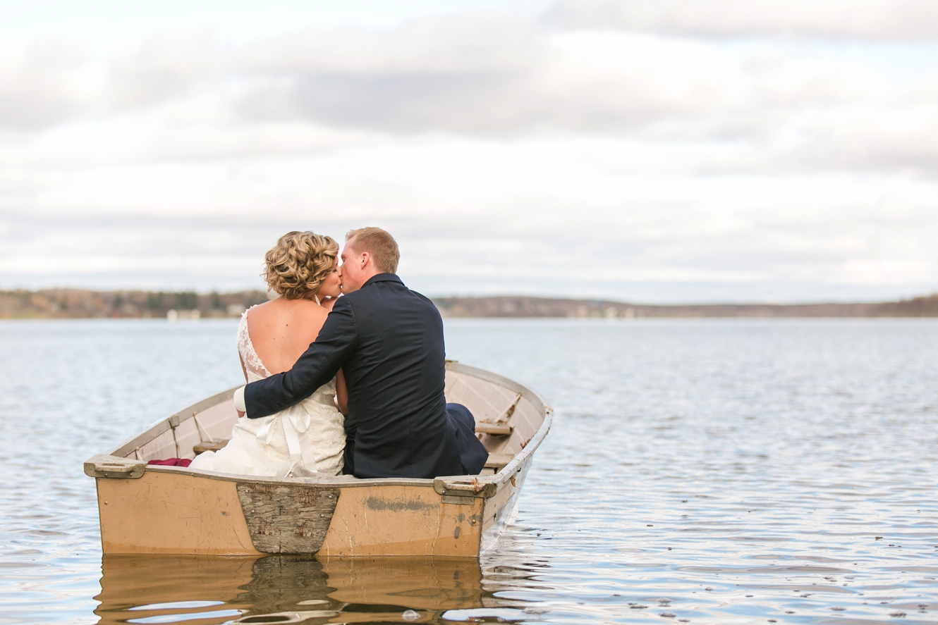 Bride and groom in rowboat photo