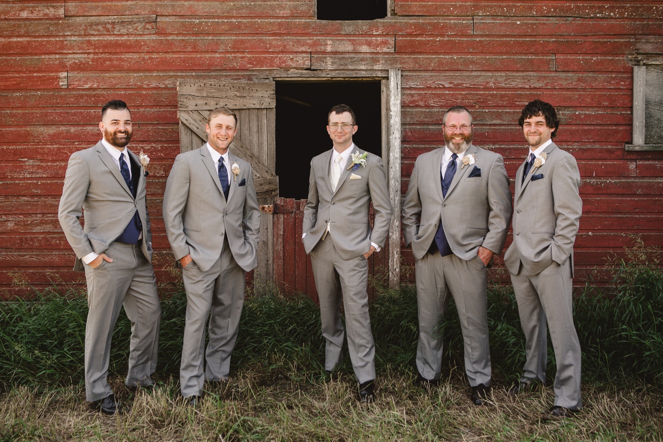 Grey and navy groomsmen suits photo