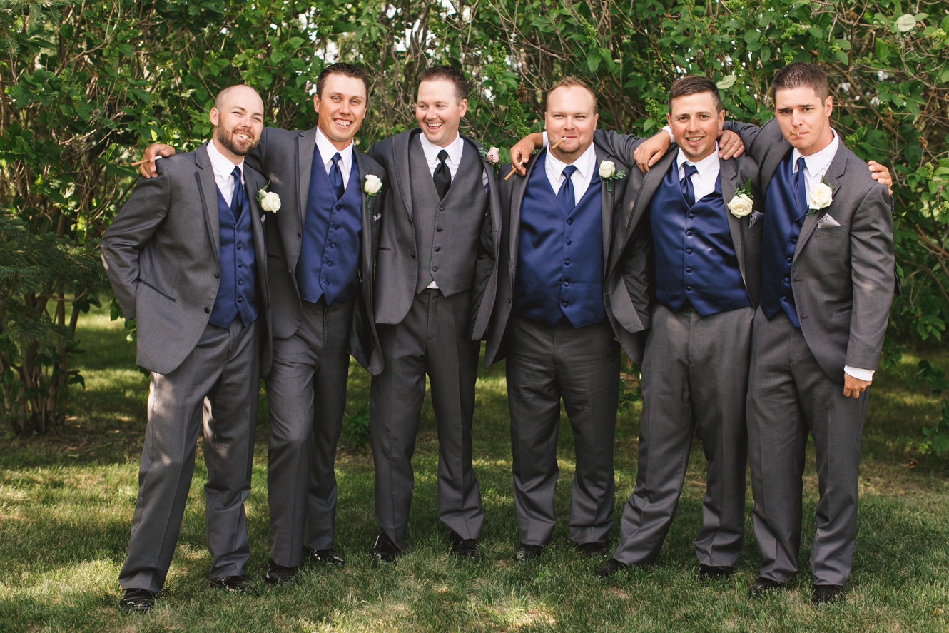Grey and navy groomsmen suits photo