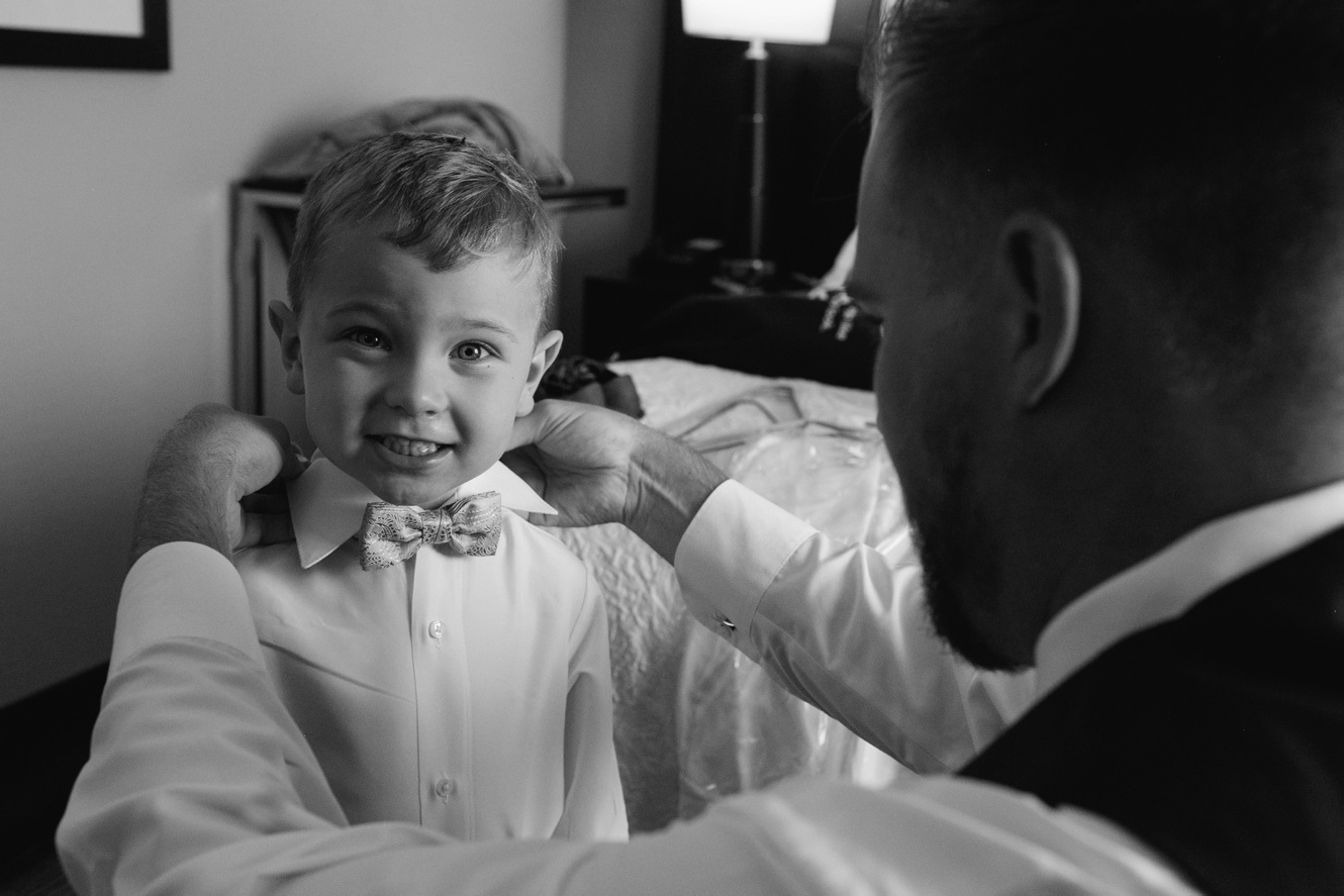 ring bearer with bow tie black and white photo