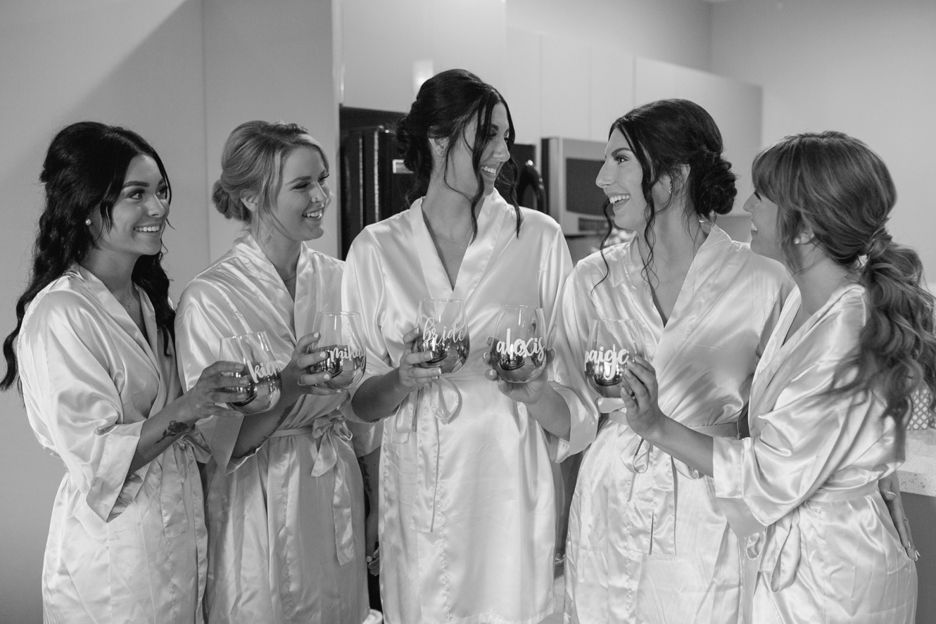 bride and bridesmaids in robe photo